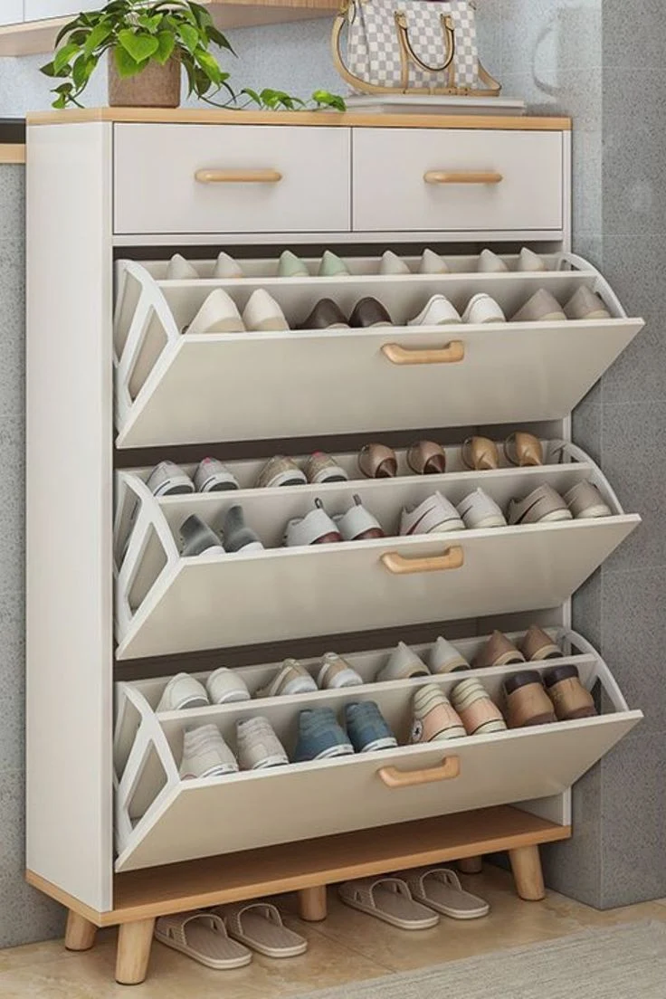 Modern shoe rack design by an interior design company in Malappuram for organized spaces.